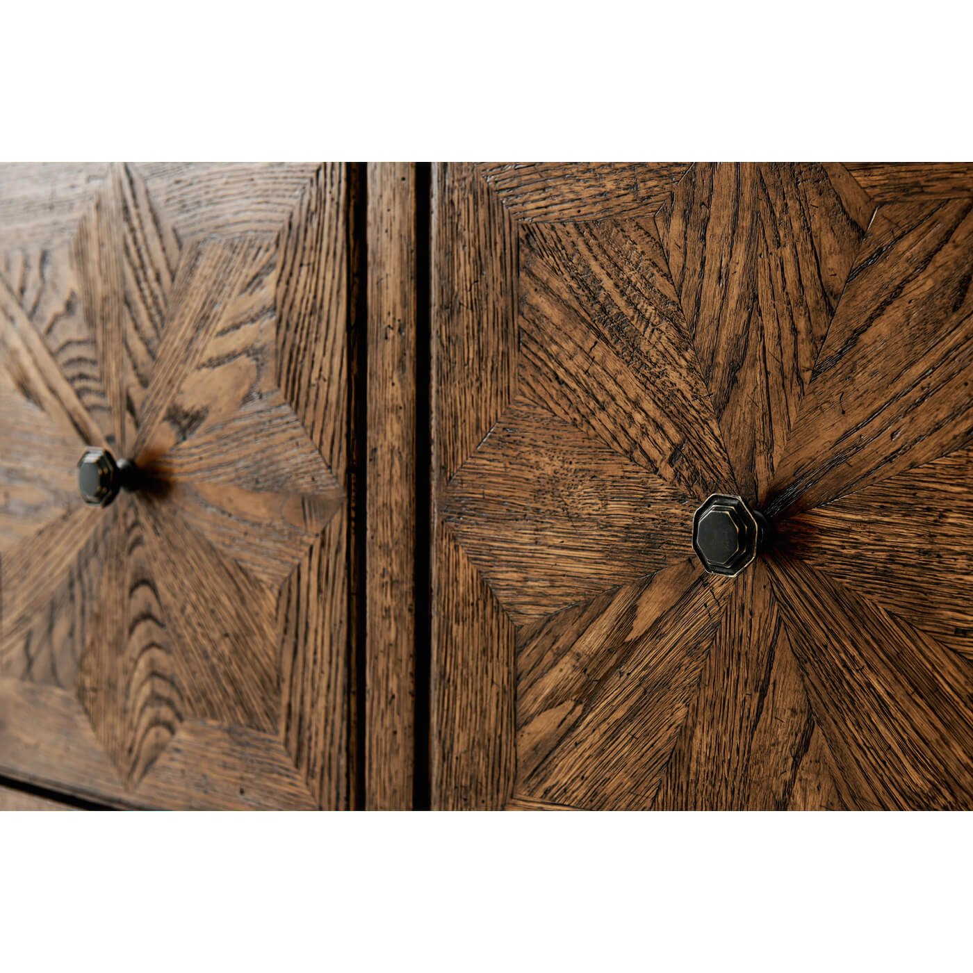 Close-up, decorative detail, oak four door buffet knobs.