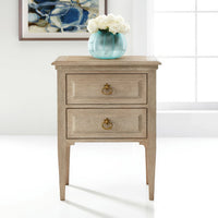 Oak Louis XVI bedside table with blue vase decor.