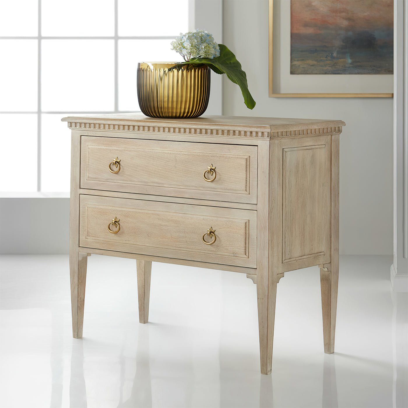Oak Louis XVI chest placed in modern room.