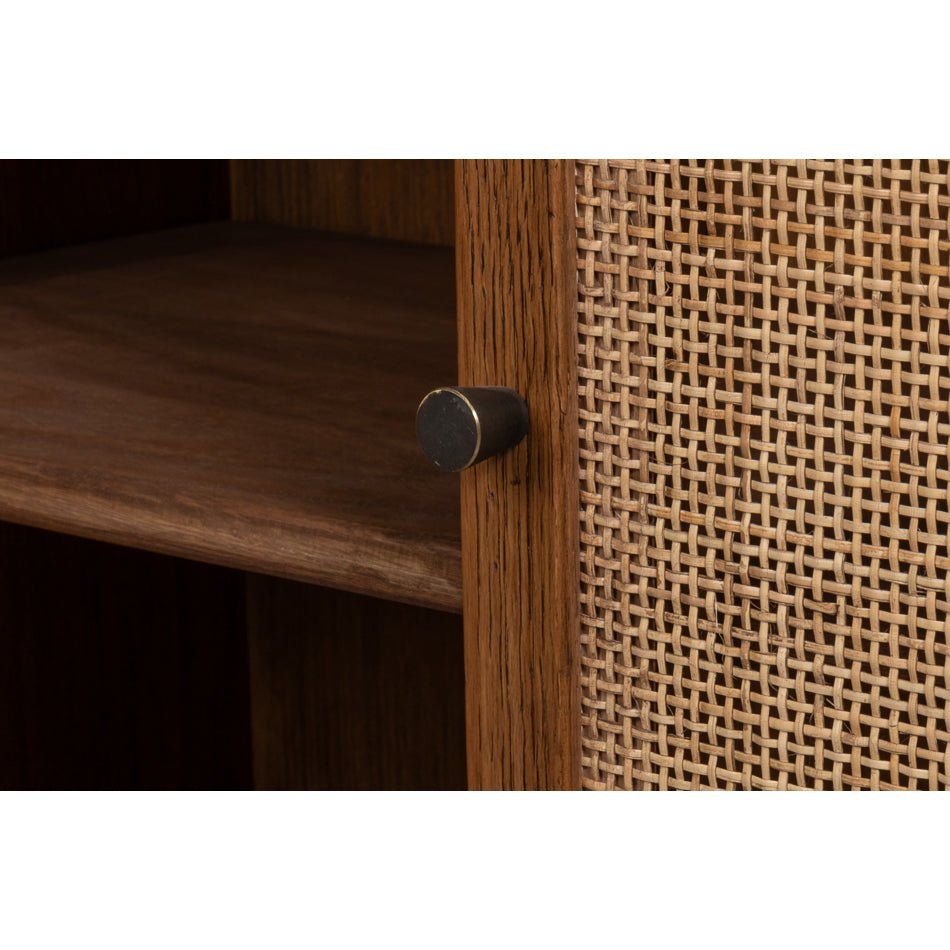 Close-up of credenza handle and cane paneling.