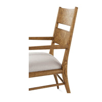 Close-up oak dining chair backrest detail.
