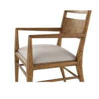 Close-up oak dining chair arm and seat.