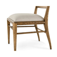 Close-up of seat cushion and legs, oak dining chair.