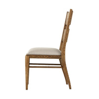 Side profile of light oak parquetry dining chair.