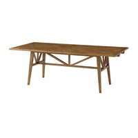 Oak dining table without extension leaves, angled view.