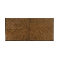 Top view of oak dining table, showing parquetry design.