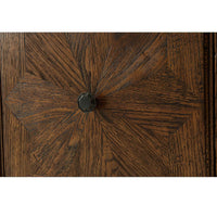 Close-up of oak cabinet door with knob detail.