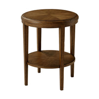 Oak side table in living room setting, angled view.