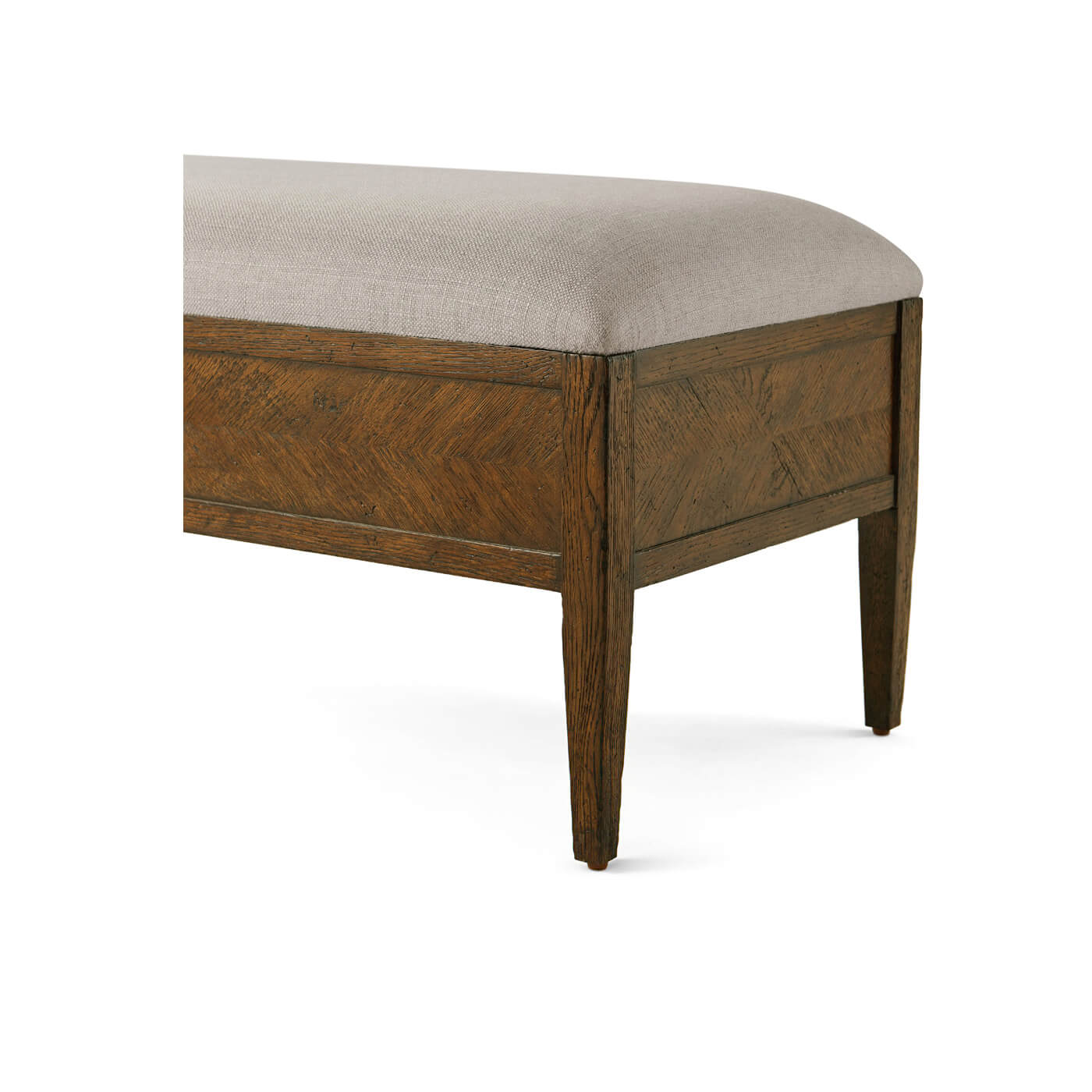 Upholstered bench corner detail, focusing on parquetry design.