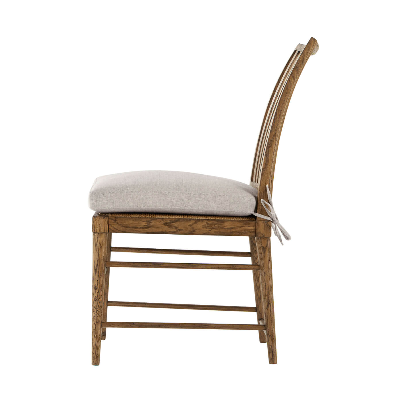 Side profile of oak dining chair, cushion detail.