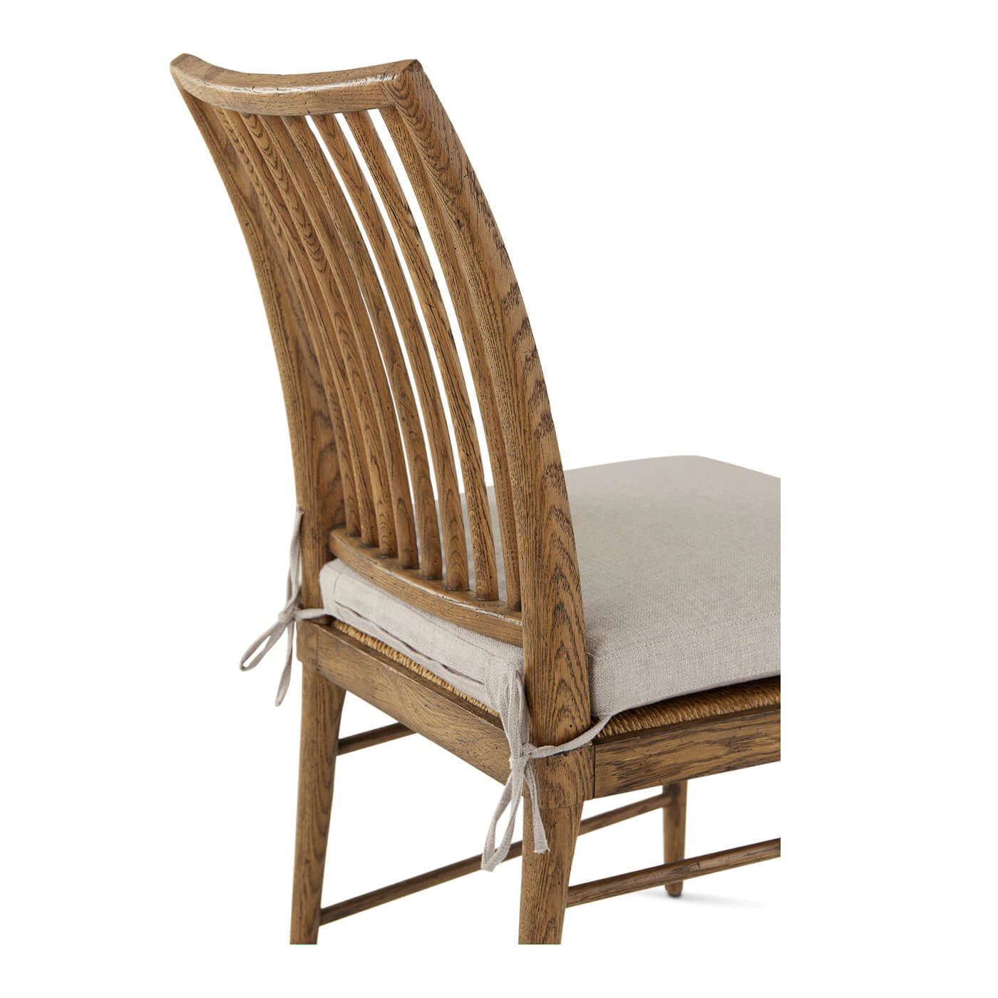 Close-up of oak chair back and cushion ties.