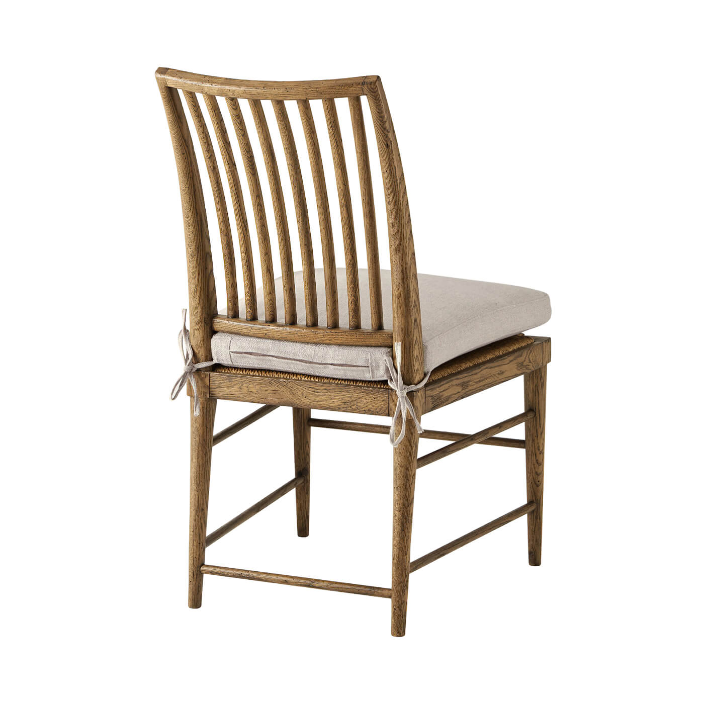 Back view of oak dining chair showing slatted design.
