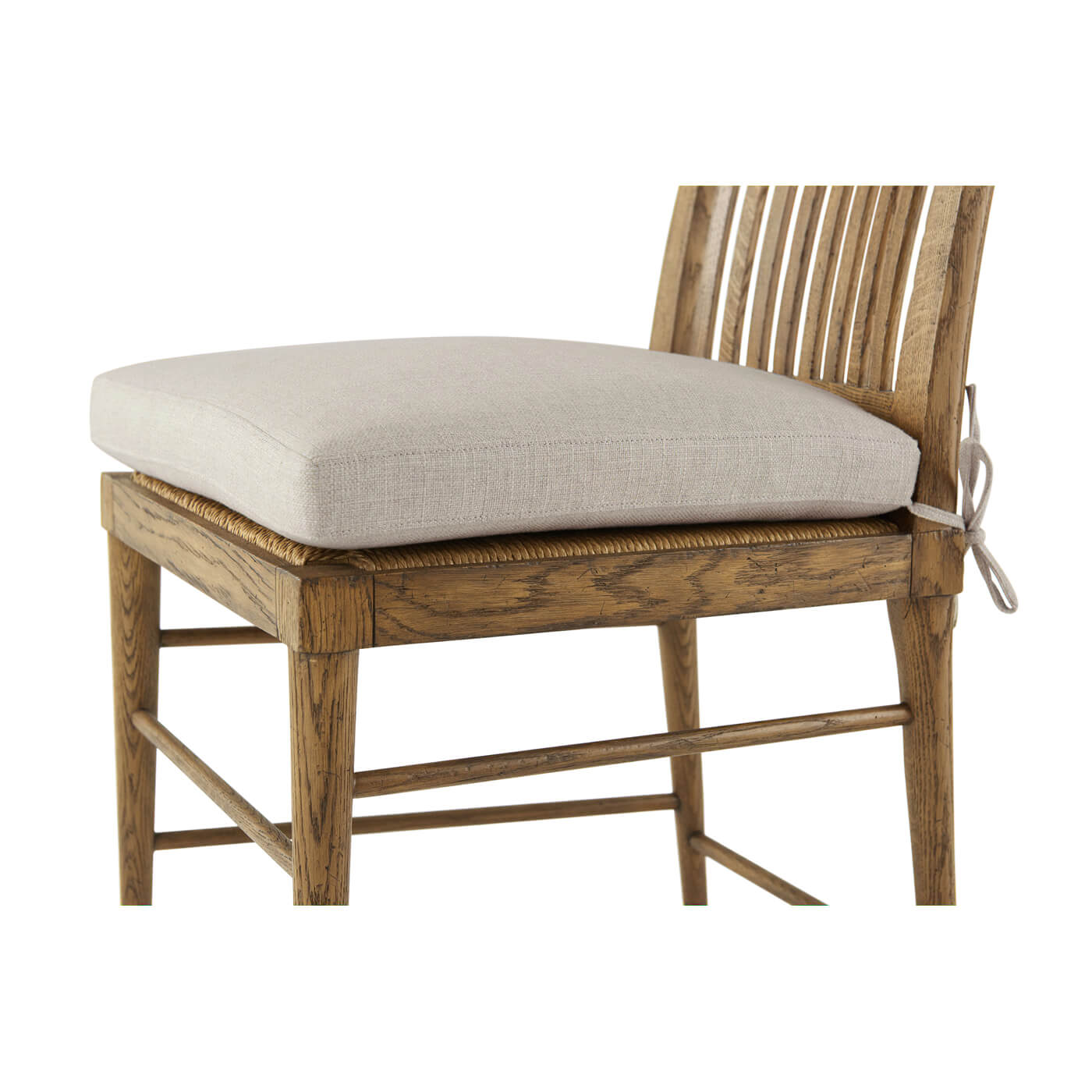 Cushion detail on oak slatted dining chair.