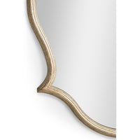 Curved edge focus of oak Venetian mirror.