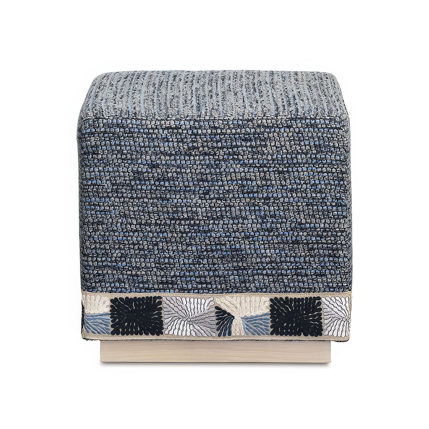 Front view of blue cube ottoman with pattern trim.