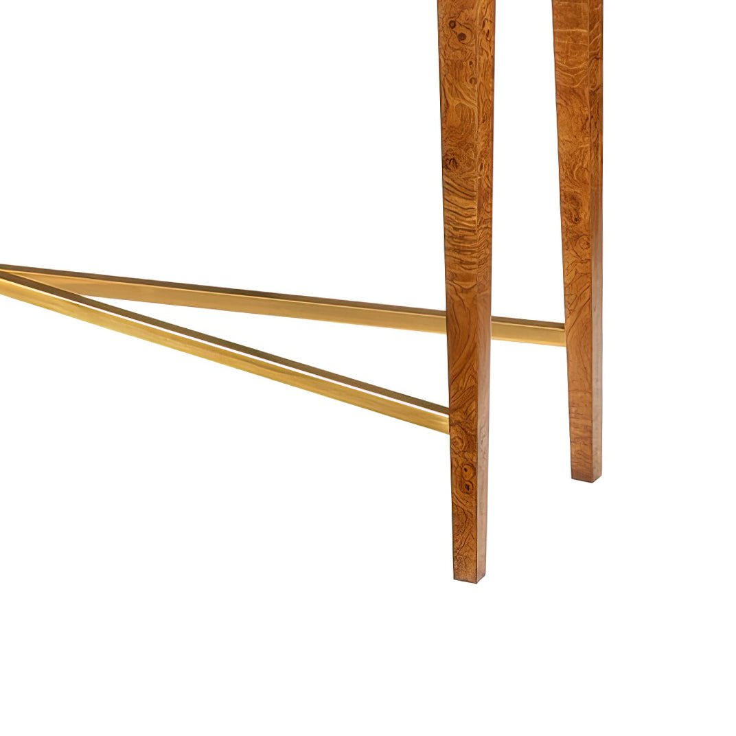 Console table legs and gold crossbar, detailed view.