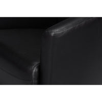 Black leather club chair, close-up armrest detail.