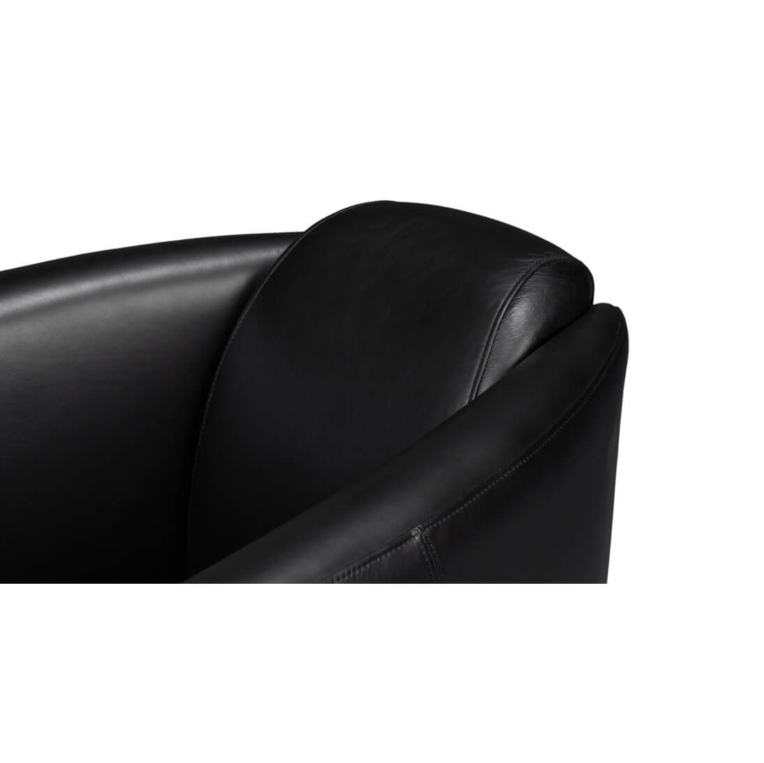 Black leather club chair, top armrest detail.