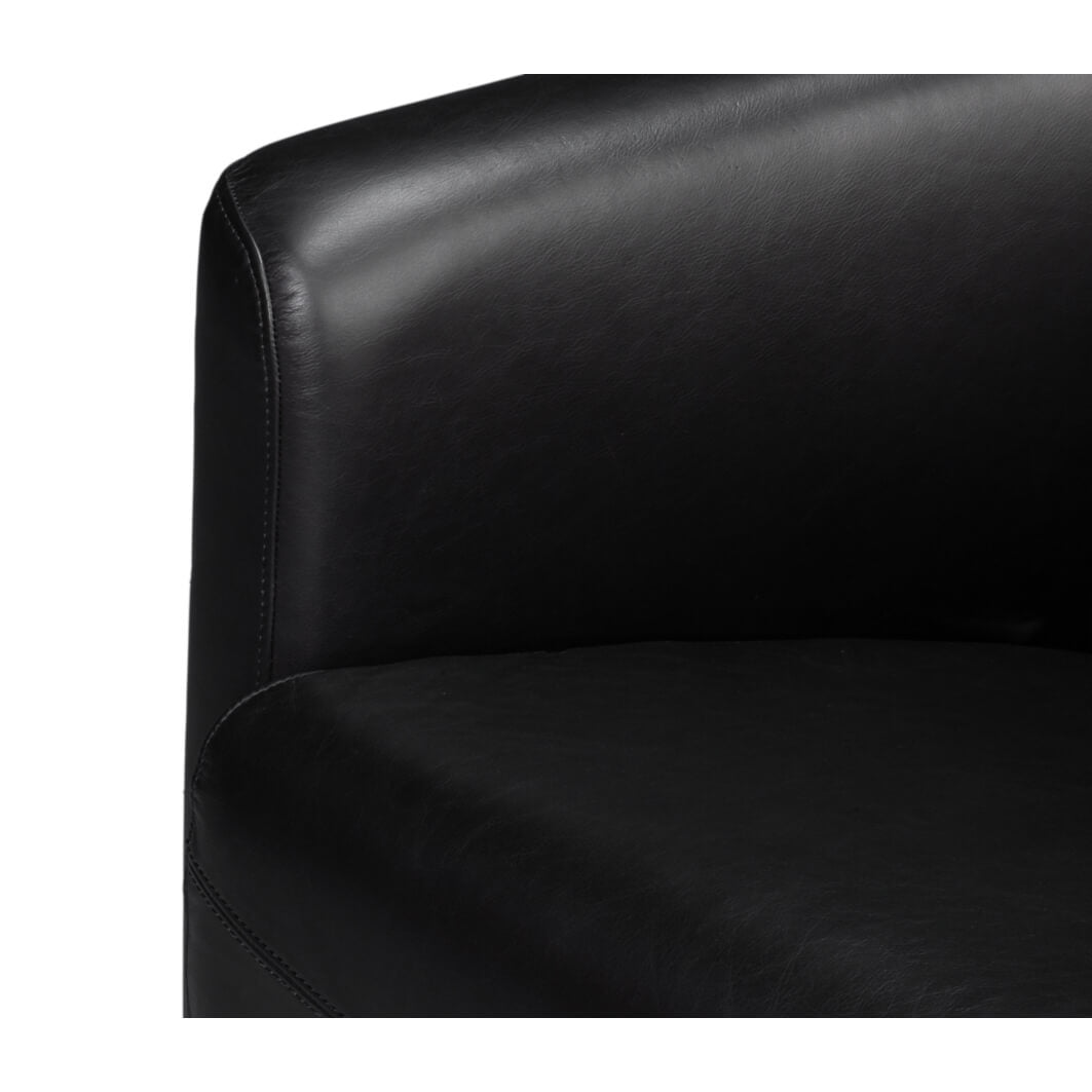 Black leather club chair, seat detail.