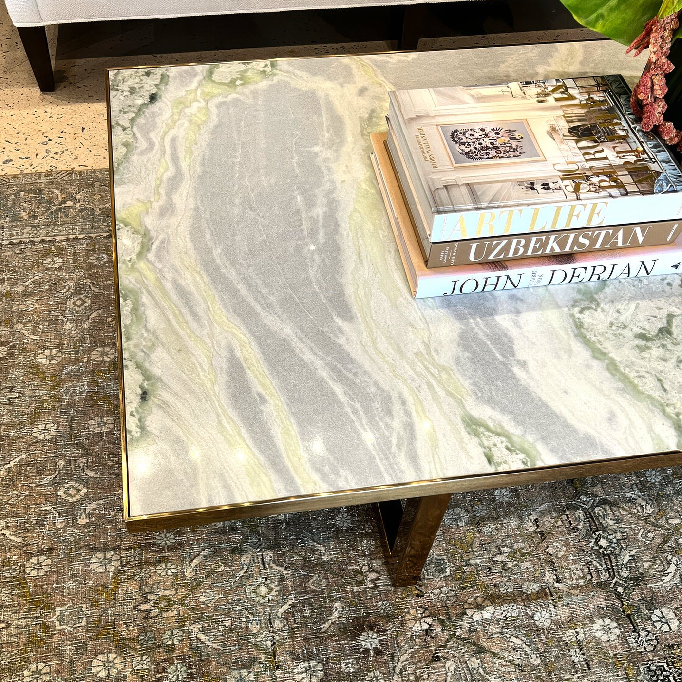 Top view of coffee table showing marble pattern, books.