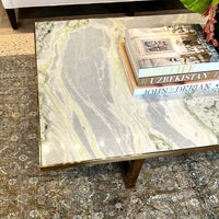 Top view of coffee table showing marble pattern, books.