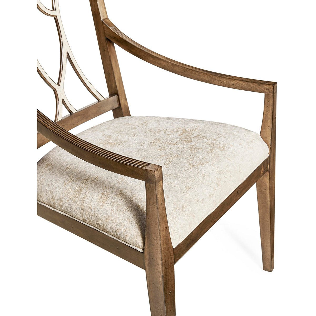 Armchair seat with light upholstery and wooden arm detail.