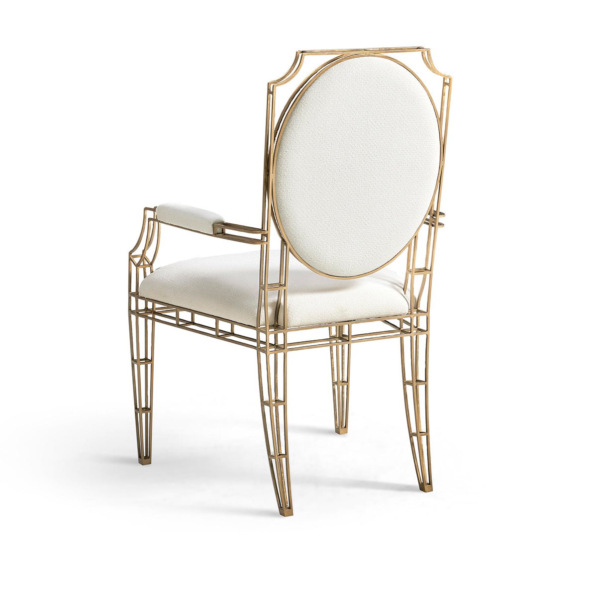 Back view of openwork steel chair, white cushion.