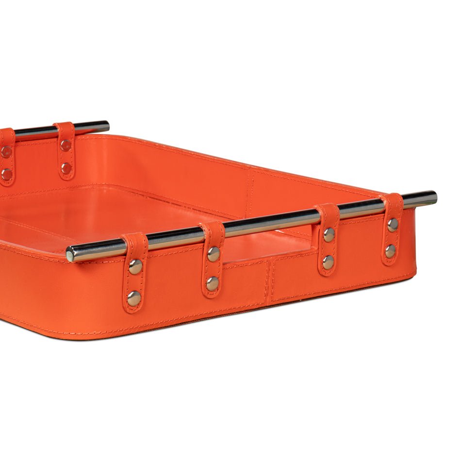 Close-up of orange leather tray corner and handle detail.