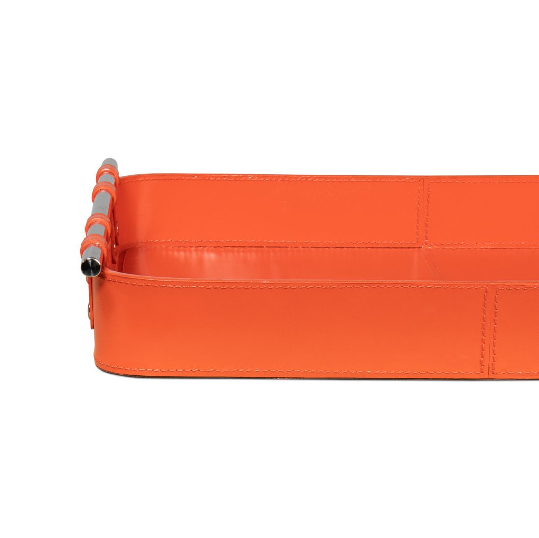 Side profile of orange leather tray highlighting depth.