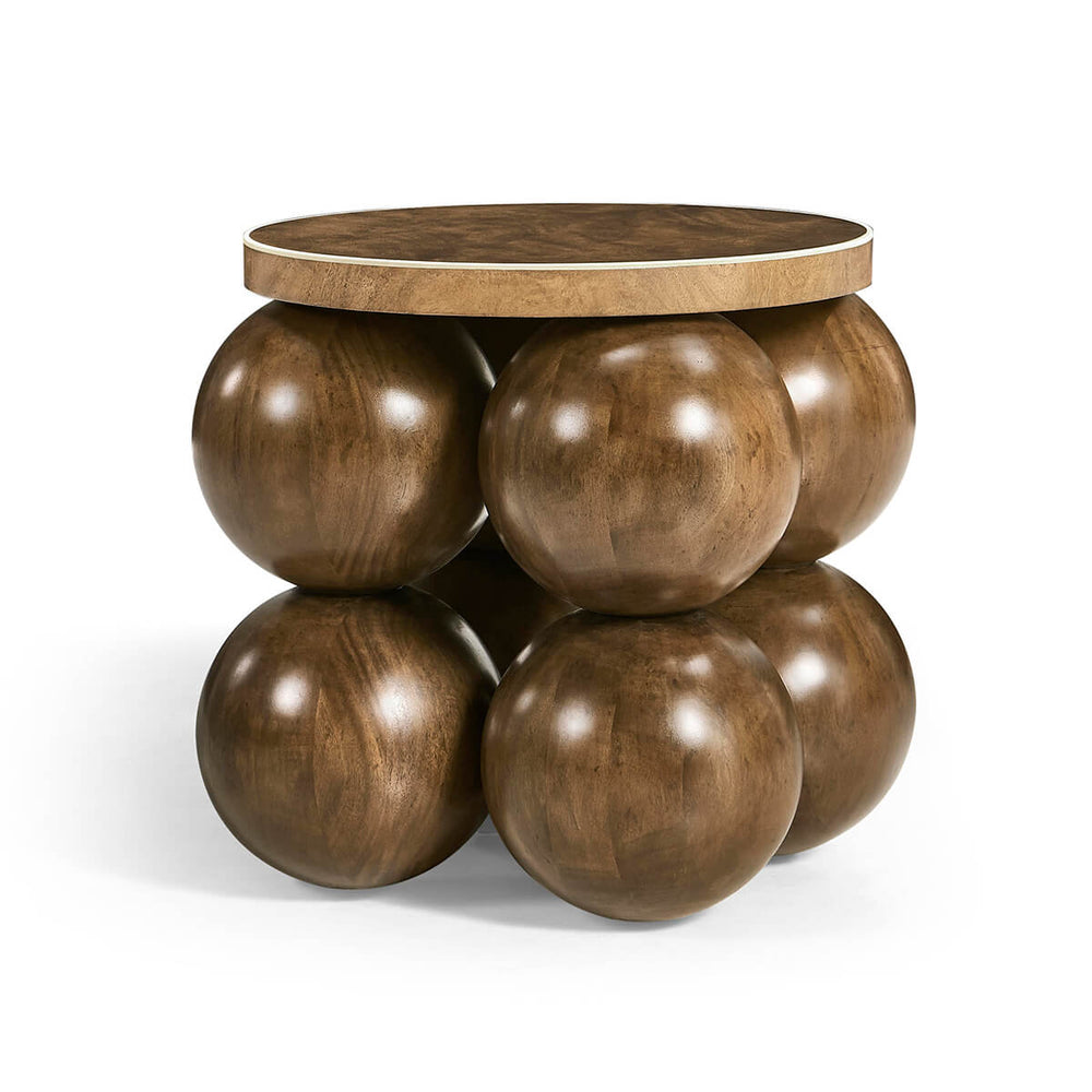 Mid-century accent table with round design and wood finish.