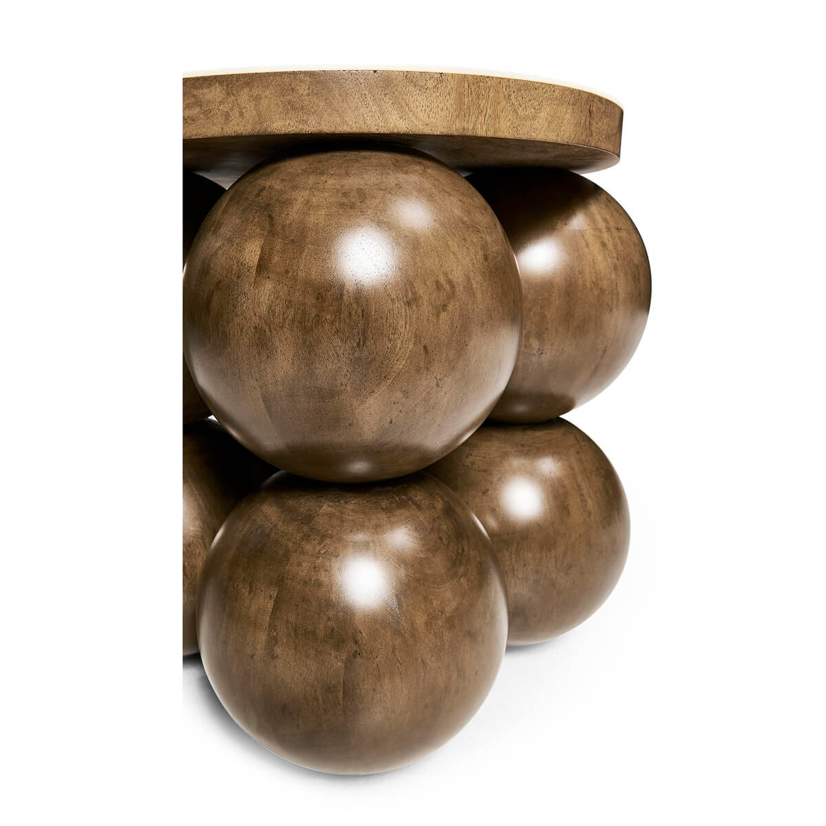 Corner view of accent table showing orb-shaped design.