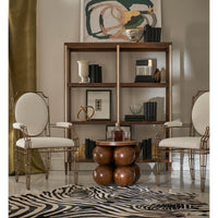 Accent table in elegant living room setup with chairs.