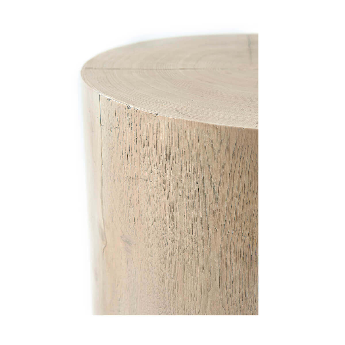Close-up of organic oak accent table edge detail.