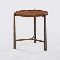 Burl top side table with detailed textured legs.