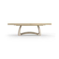 Dining table with modern curved base, front view.