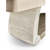 Dining table base with textured surface, close view.