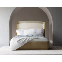 Organic king bed with draped bedding, archway backdrop.