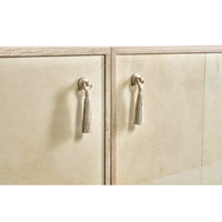 Close-up showing cabinet handles with tassels.