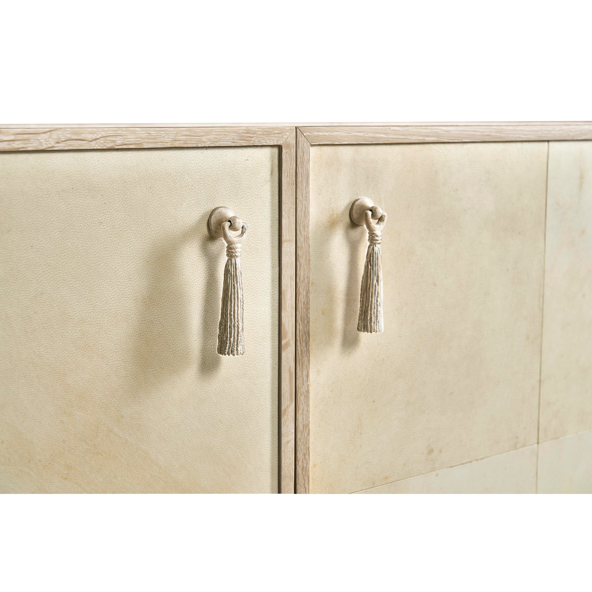 Close-up showing cabinet handles with tassels.