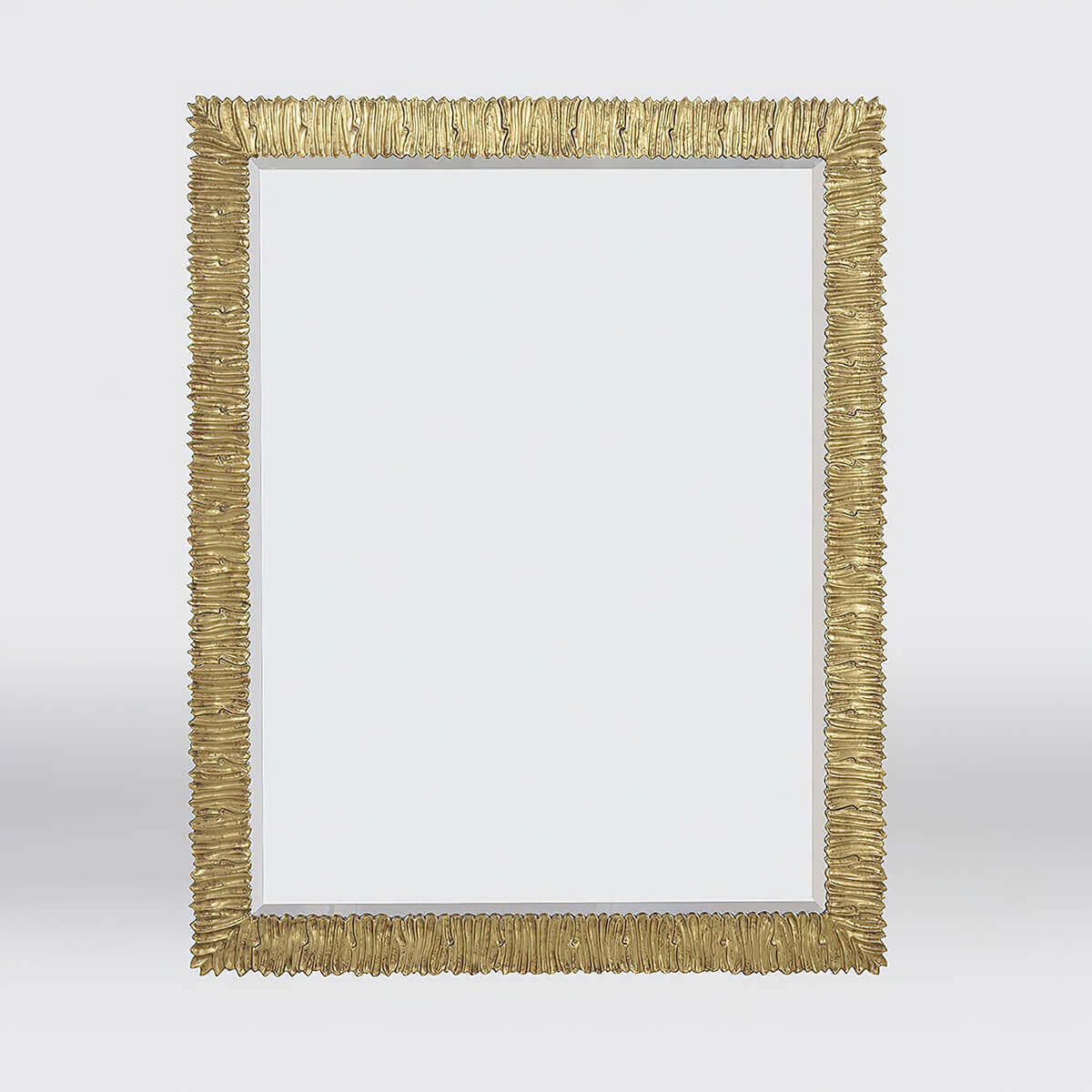 Gold-framed mirror on light background, front view.