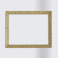 Horizontal gold-framed mirror centered against plain backdrop.