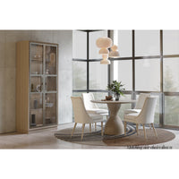 Cream linen armchairs, dining room setup around table.
