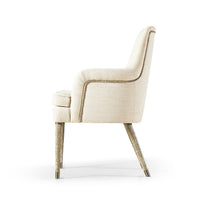 Cream linen armchair, side profile, wooden legs.