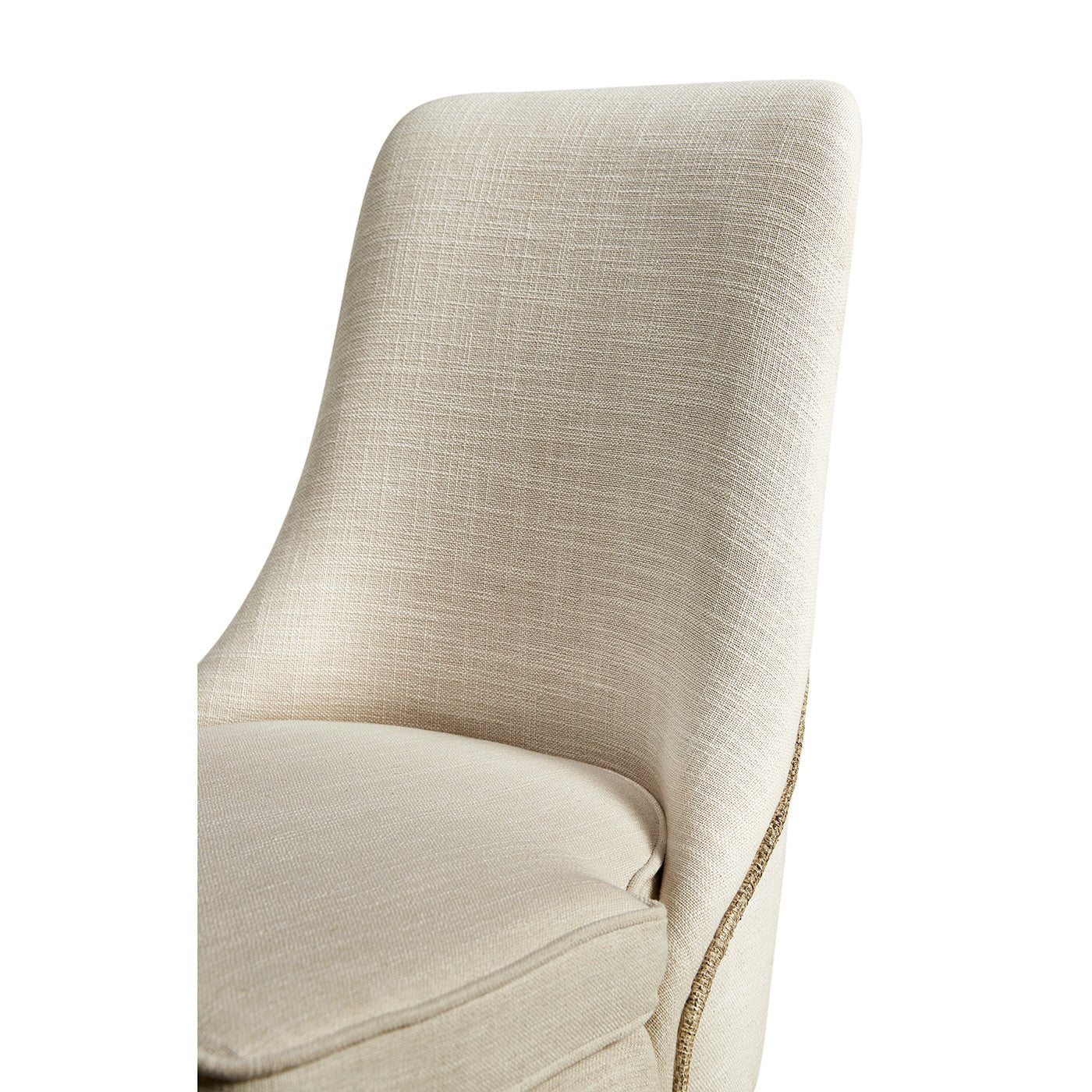 Close-up of chair's textured beige upholstery.