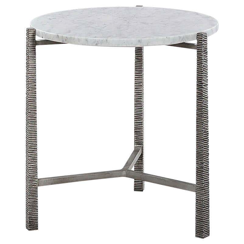 Modern marble top side table with metal legs.