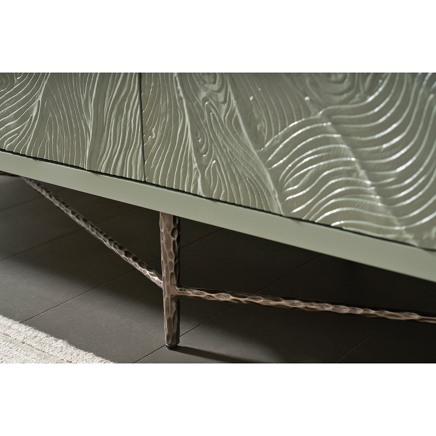 Cabinet base with detailed textured metal legs.