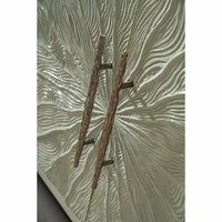 Intricate textured handles on media cabinet doors.