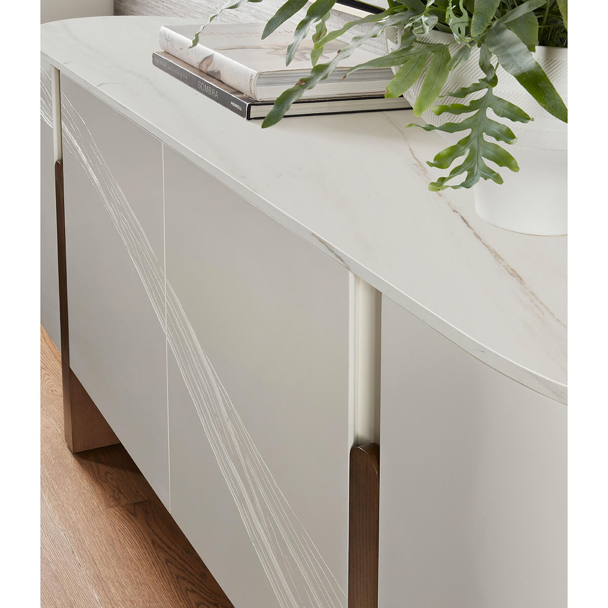 Top corner view of modern media cabinet with plants.