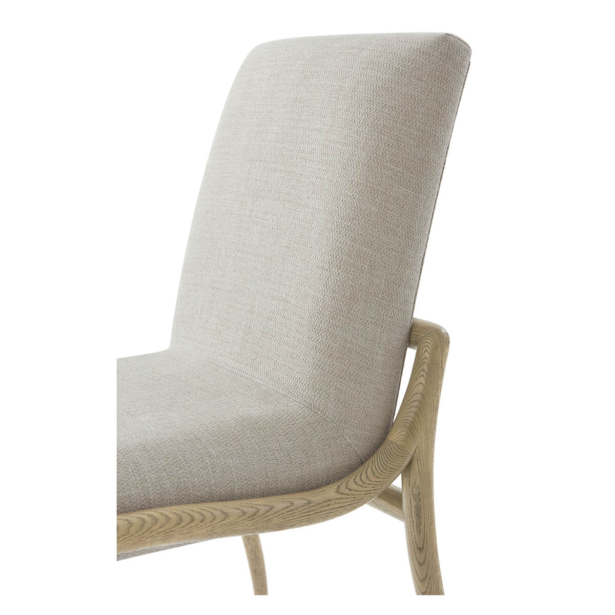 Close-up of upholstered dining chair backrest and seat.