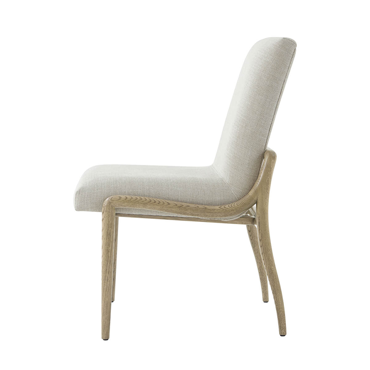 Side profile of modern dining chair with beige upholstery.